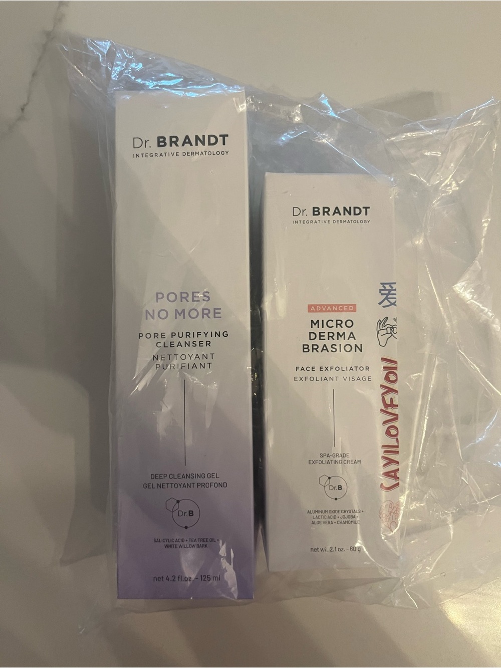 Dr. Brandt White and Light Purple Skincare Duo